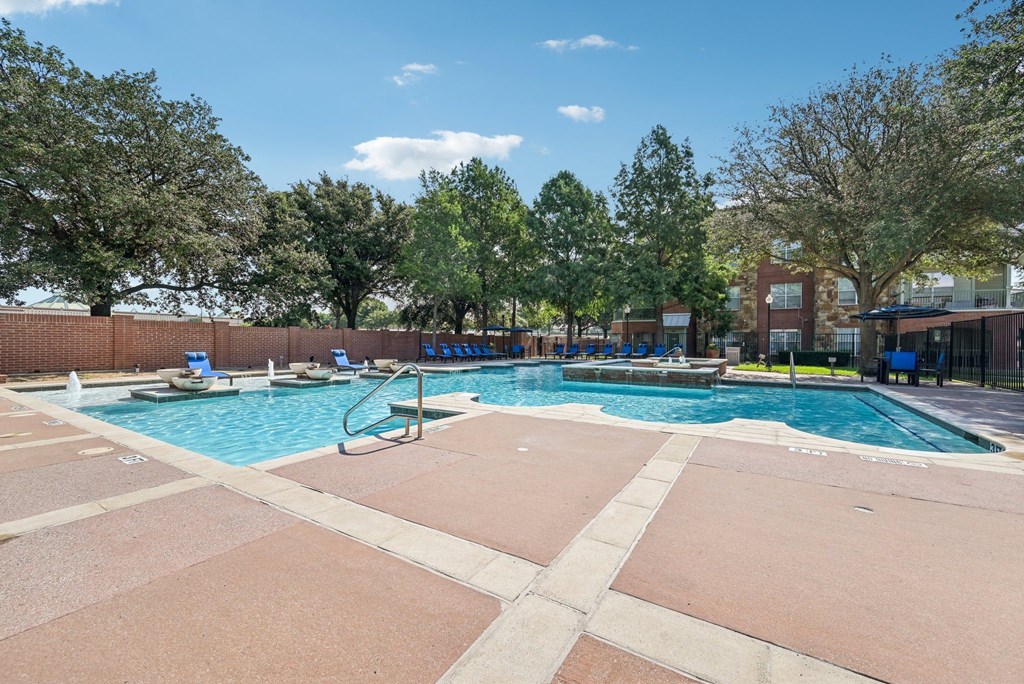 our apartments have a pool with chairs and trees