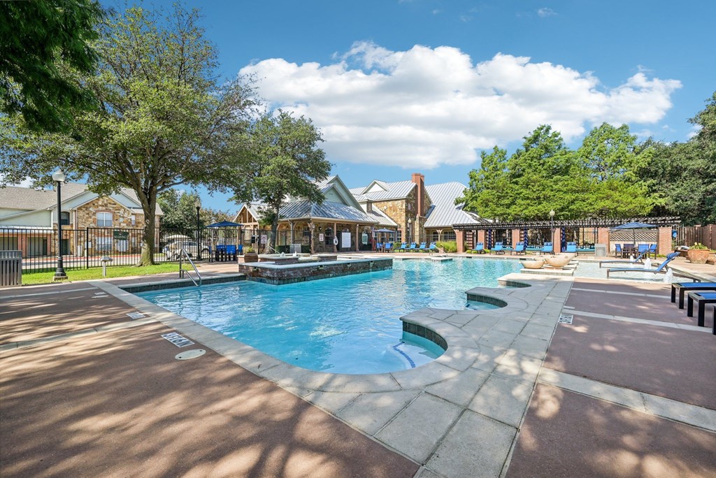 the swimming pool at the preserve at polo ridge apartments tx