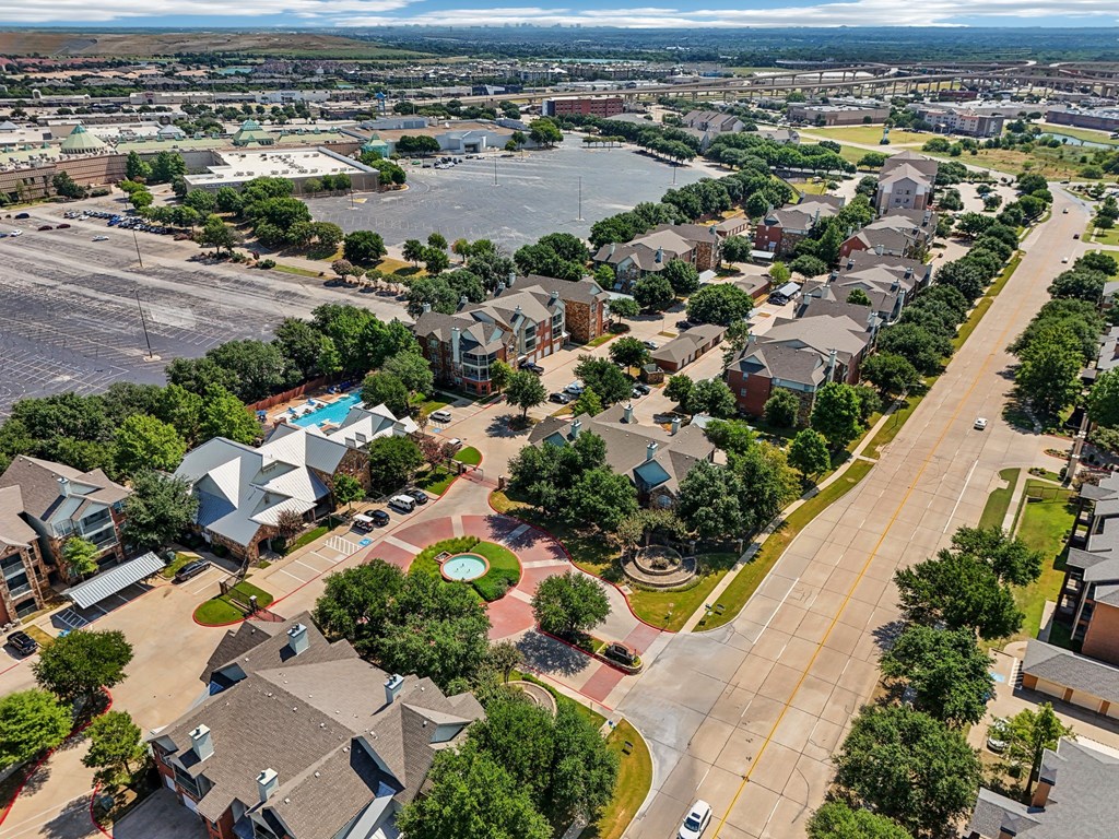 an aerial view of a neighborhood with houses and a parking lot