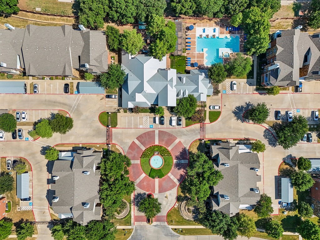 an aerial view of a neighborhood with houses and trees