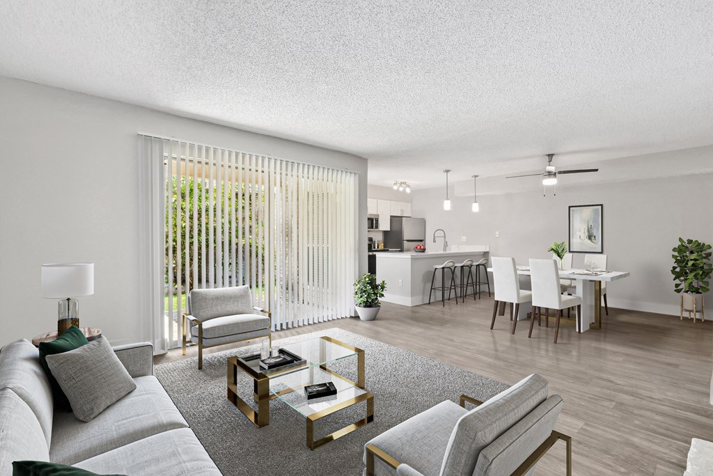 our apartments offer a living room with a couch a coffee table and a dining table