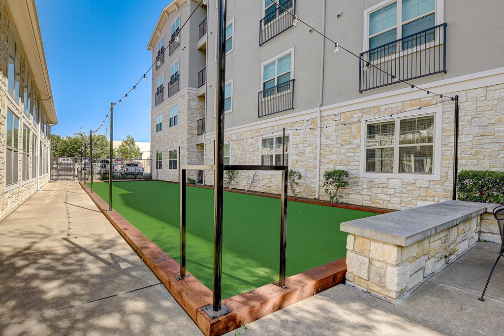 our apartments have a spacious courtyard with a green lawn and a basketball court
