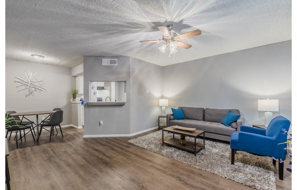 a living room with a couch and a dining room table