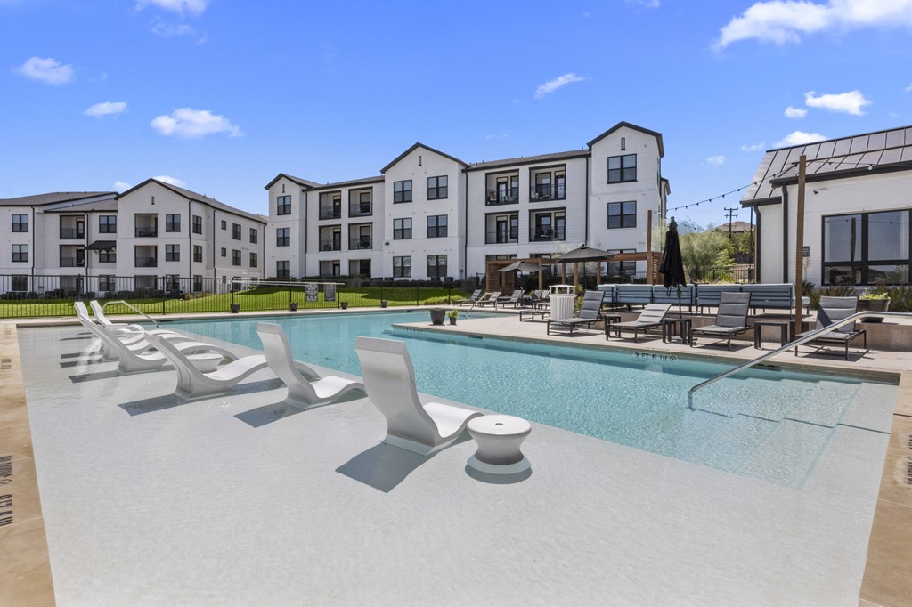 our apartments have a large swimming pool with lounge chairs