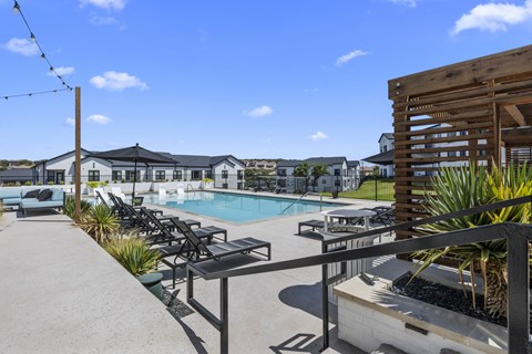 the preserve at ballantyne commons pool and patio area with chairs and a pool