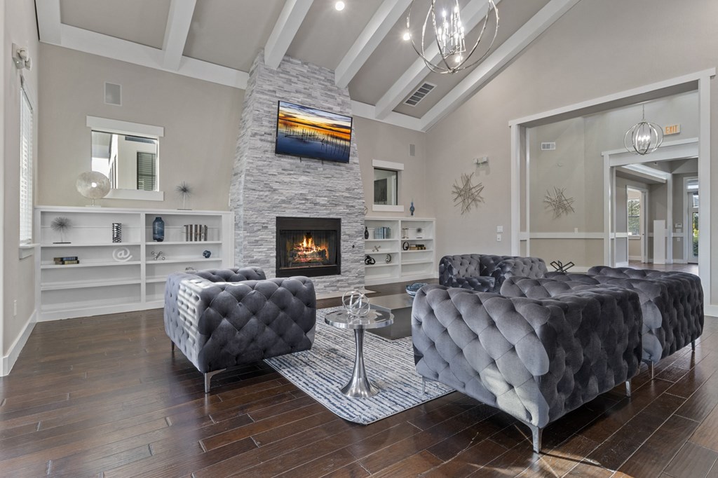 a living room with couches and a fireplace