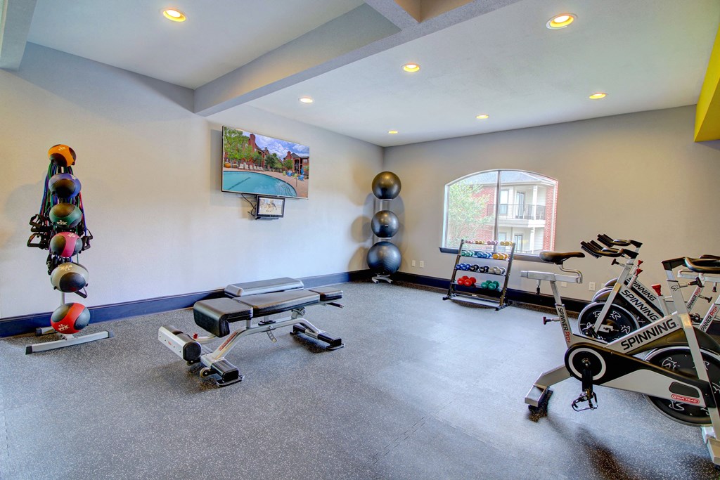 a home gym with weights and exercise equipment