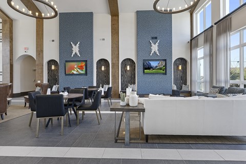 a restaurant with blue and white walls and tables and chairs