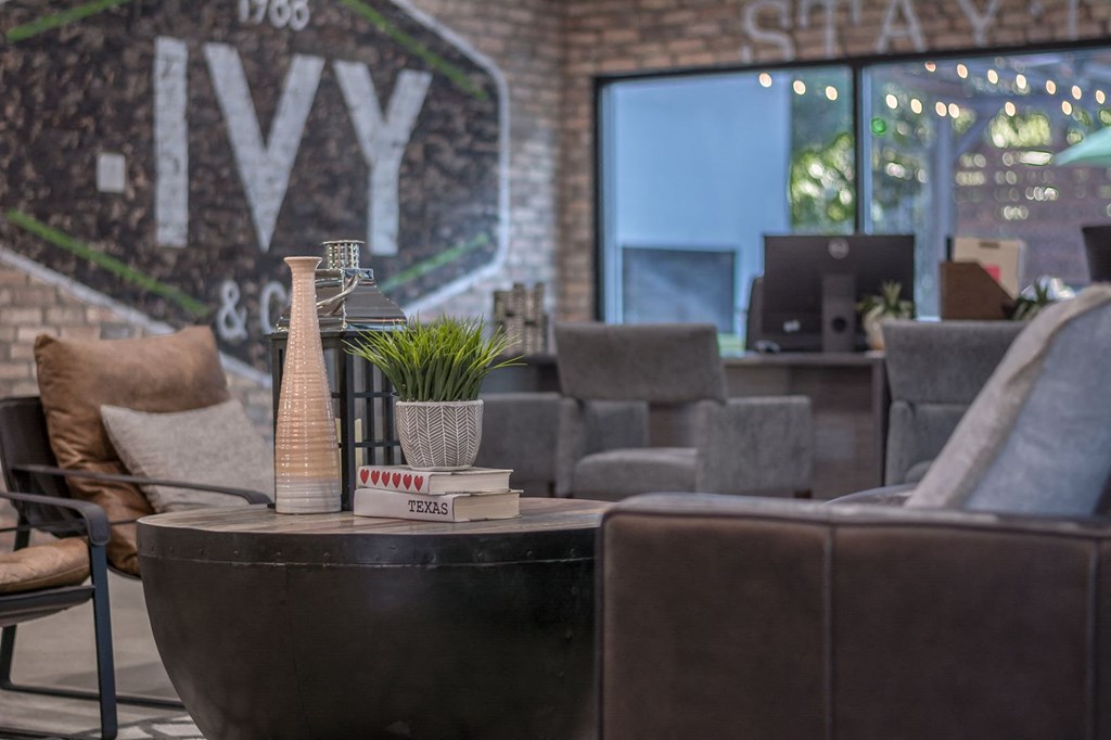 a coffee table with books and a plant on top of it