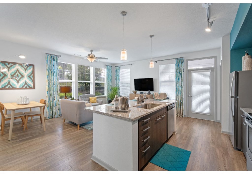 an open floor plan with a kitchen and living room