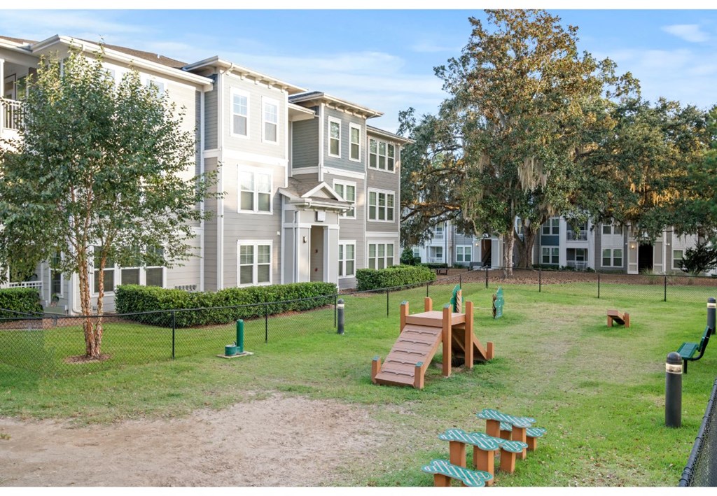 an image of a playground in front of an apartment building