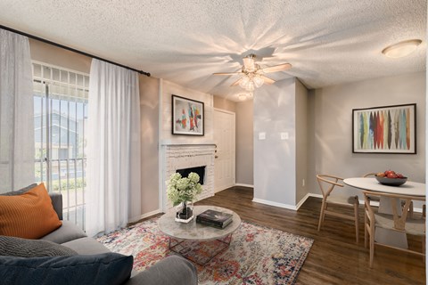 A living room with a grey couch and a white coffee table.