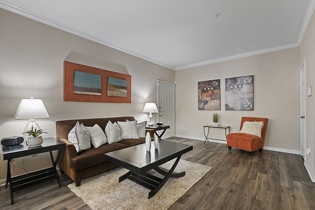 a living room with a leather couch and a coffee table
