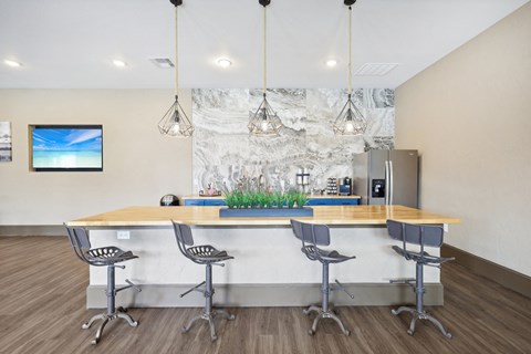 the preserve at ballantyne commons clubhouse with bar and chairs