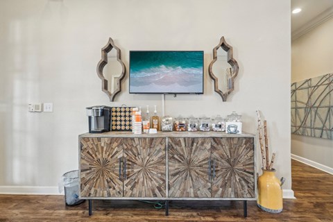 the tasting room with a bar and a painting on the wall
