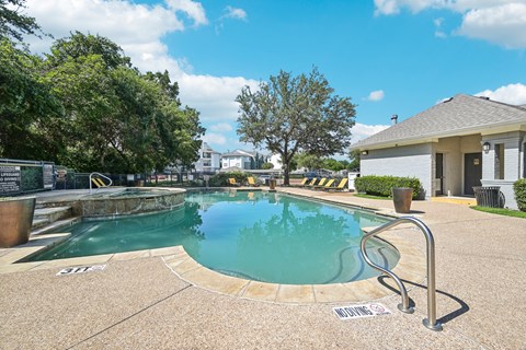 the preserve at ballantyne commons pool and spa with building and trees