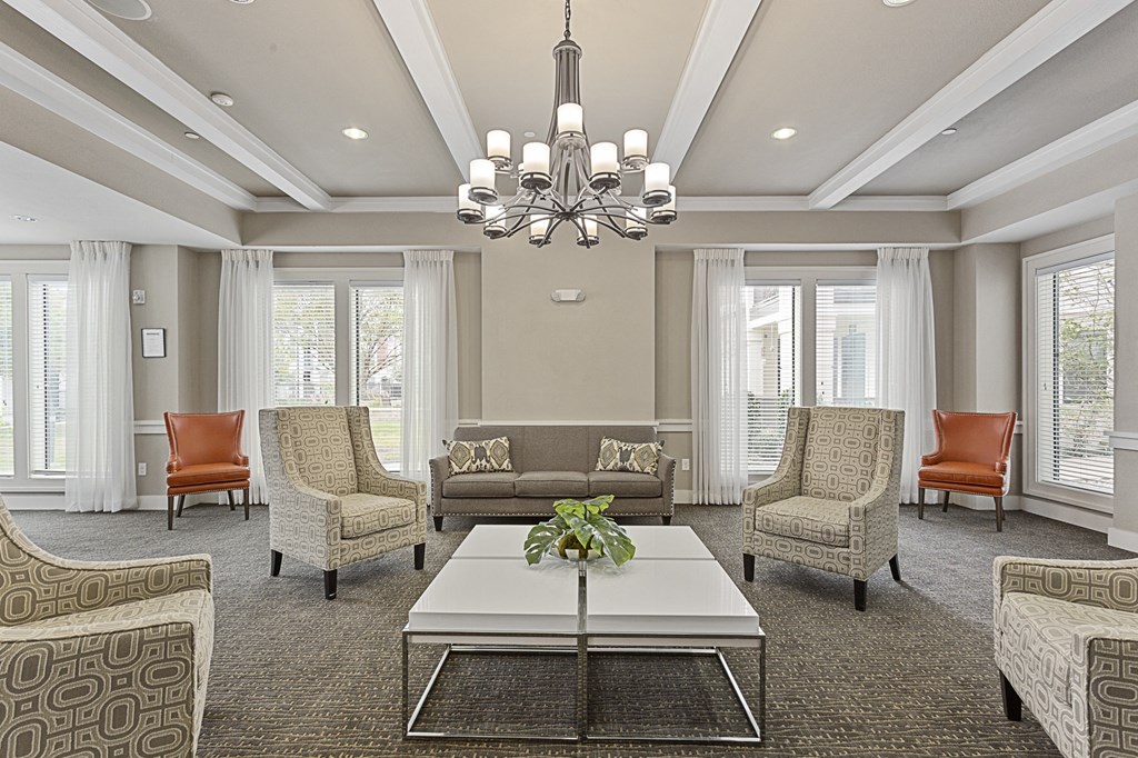 a living room with couches and chairs and a coffee table
