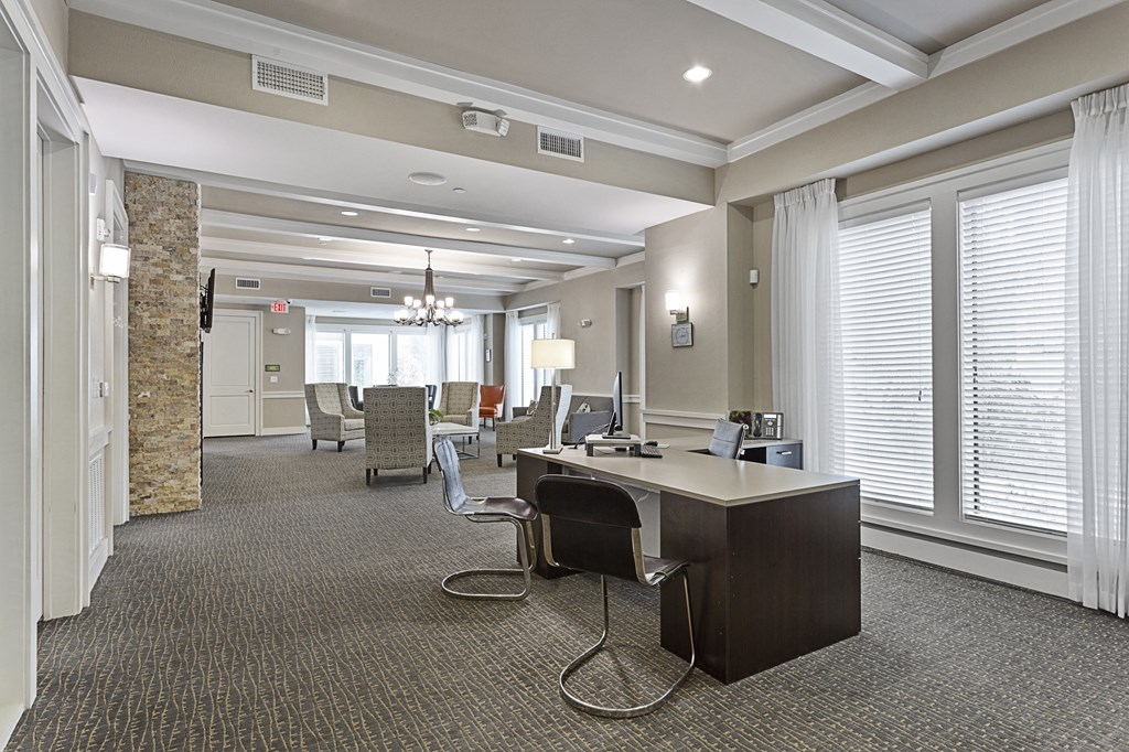 a large office space with a desk and chairs