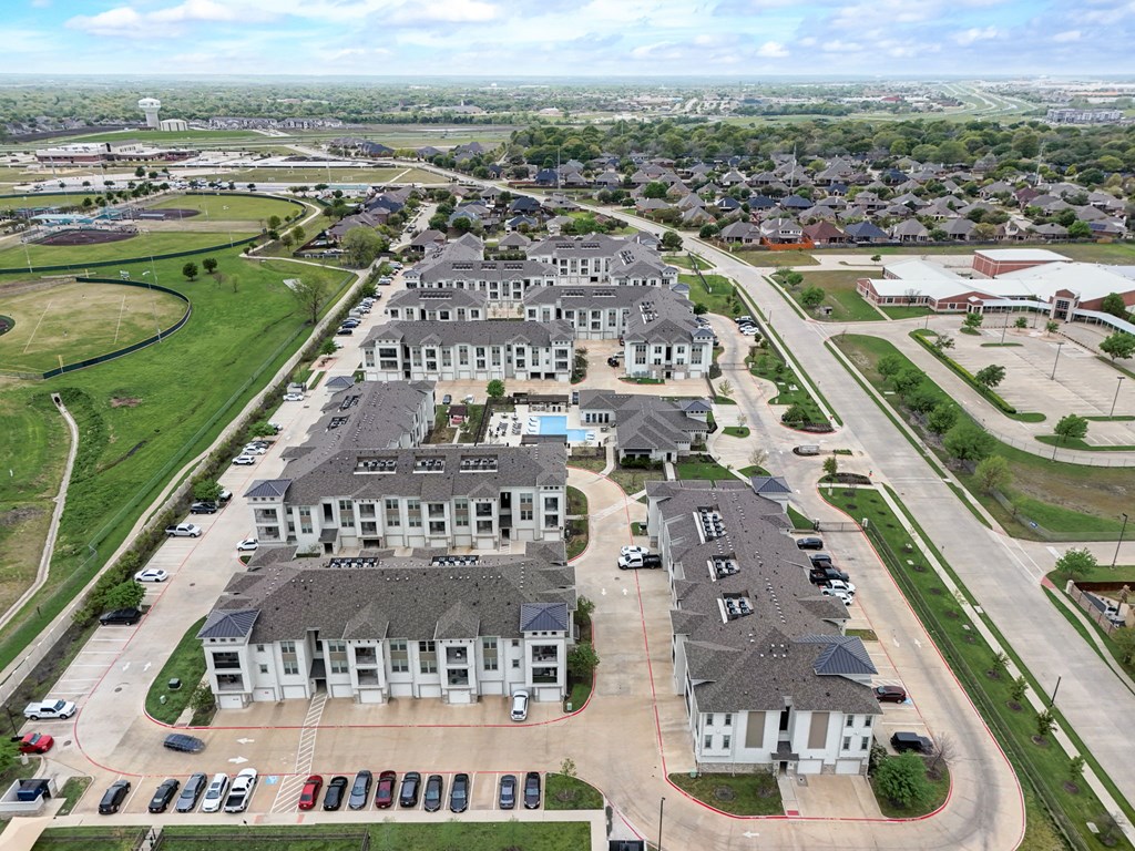 an aerial view of a group of houses in a city