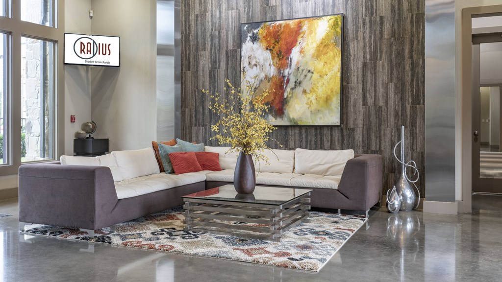 a living room with a couch and a table