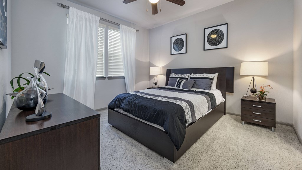 a bedroom with a bed and a dresser