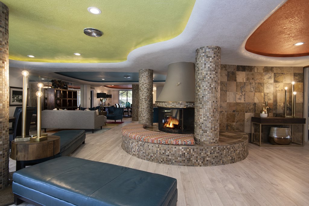 a large living room with a large fireplace