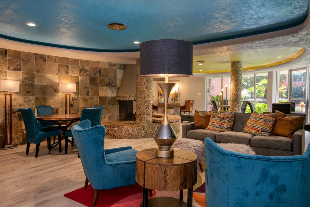 a living room filled with furniture and a large window