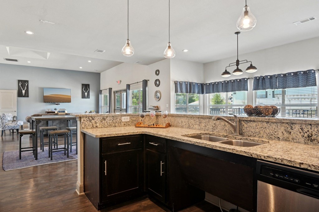 a kitchen with granite counter tops and a sink