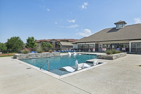 the preserve at ballantyne commons pool with a building in the background