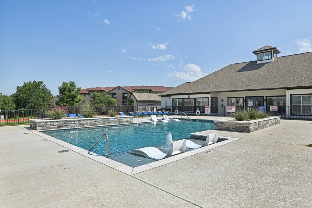 the preserve at ballantyne commons pool with a building in the background