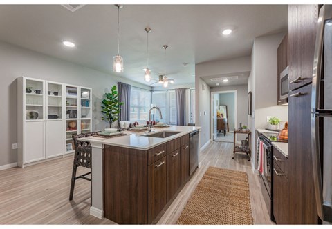 a large kitchen with an island in the middle