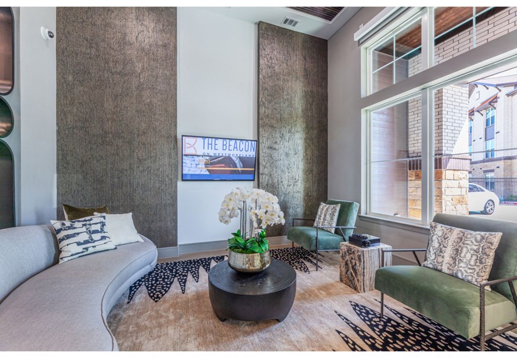 a living room with a large window and a couch