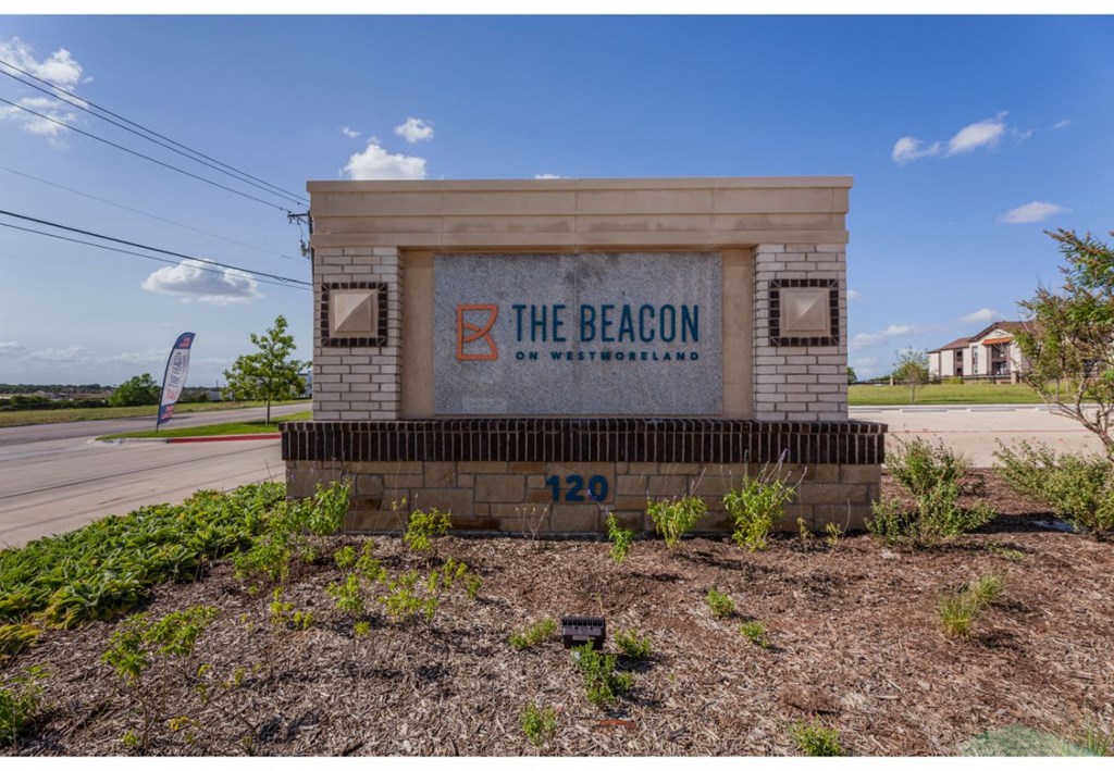 the beacon sign on the side of the road