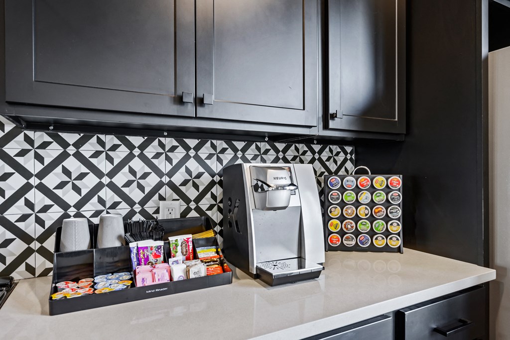 a kitchen with a coffee maker and a toaster on the counter