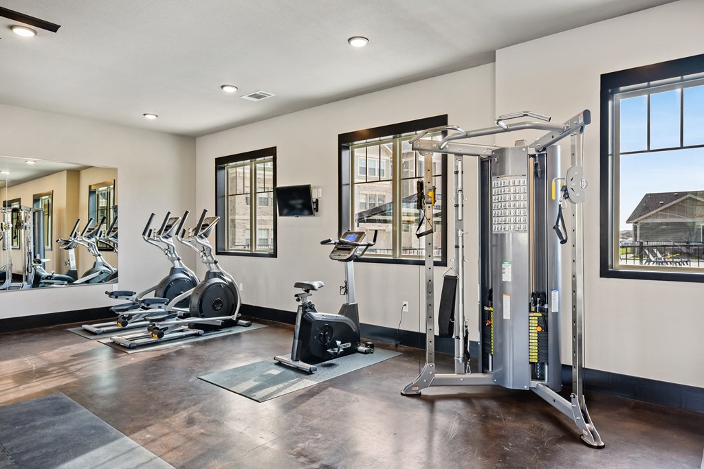 the gym at the enclave at woodbridge apartments in sugar land, tx