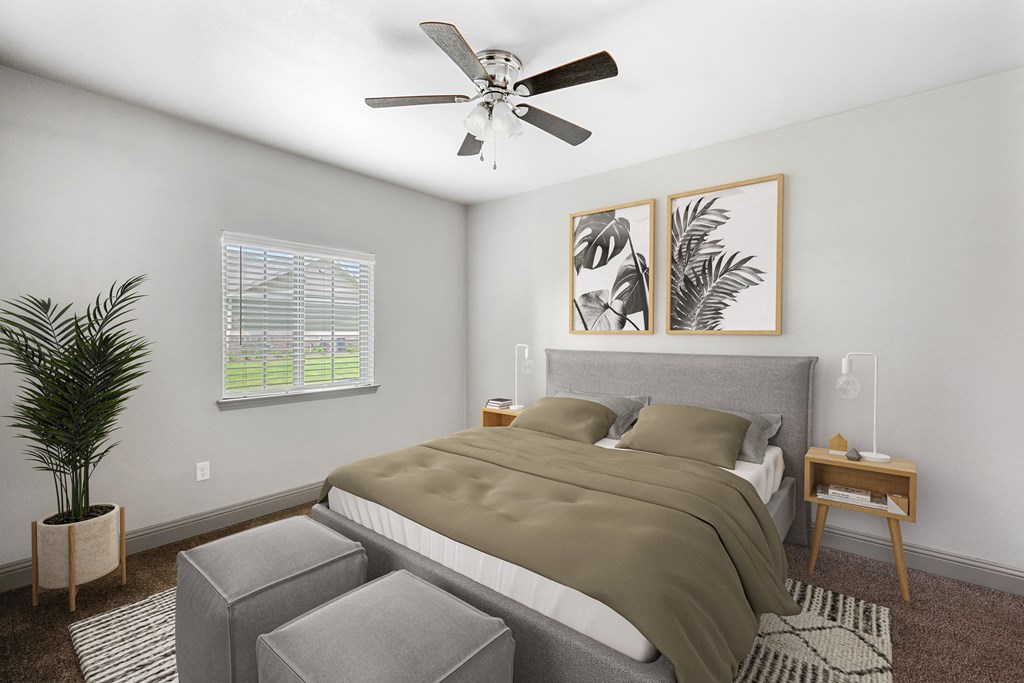 a bedroom with a bed and a ceiling fan