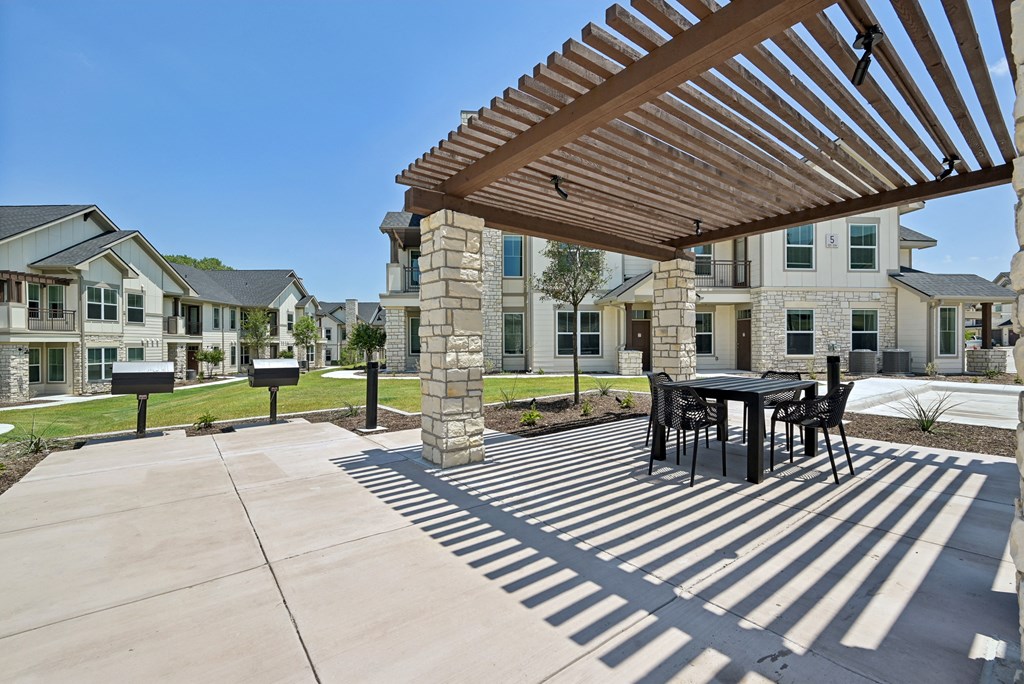 the preserve at ballantyne commons courtyard with table and chairs and buildings