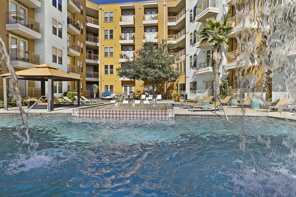 a large pool with a building in the background