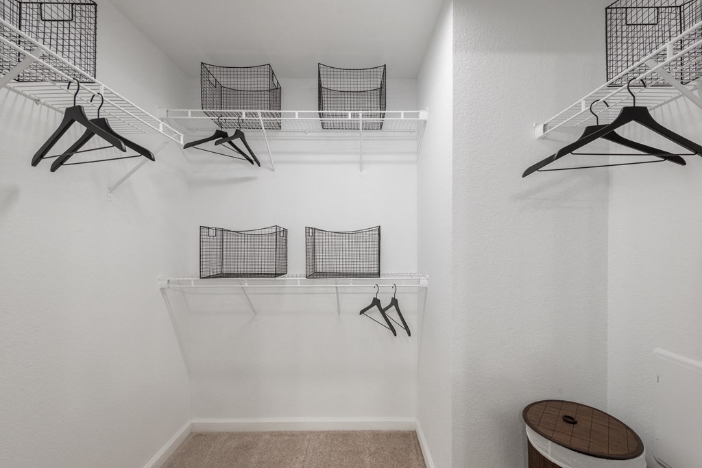 a spacious walk in closet in a 555 waverly unit