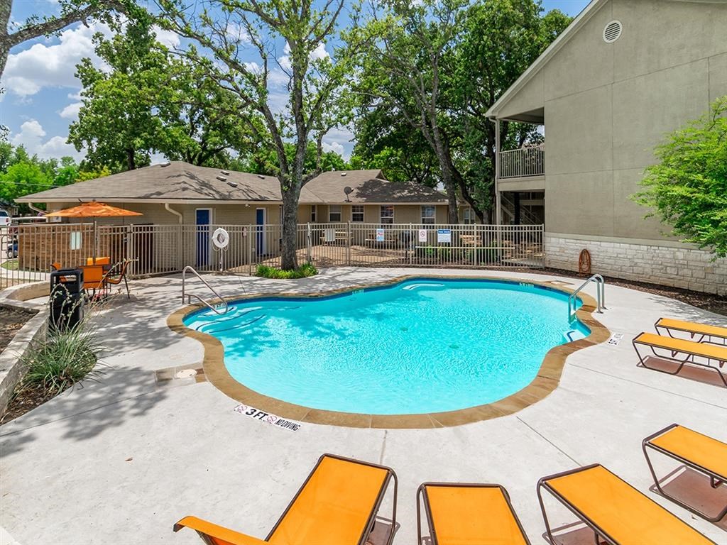 our apartments have a large pool and lounge chairs