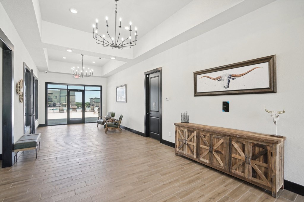 the preserve at gateway living room with wood flooring and a wooden table