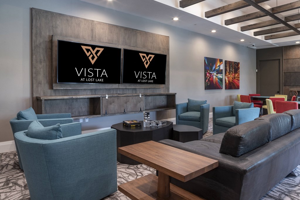 a living room filled with furniture and a large window