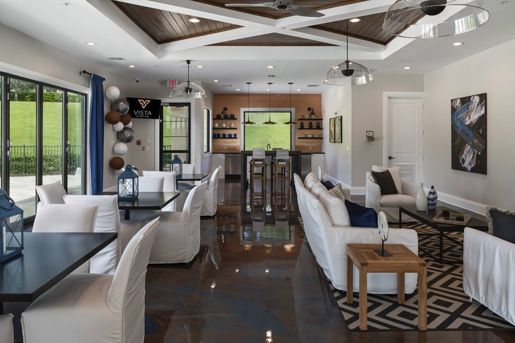 a living room filled with furniture and a large window