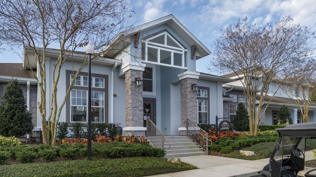 a home with a blue exterior and white trim