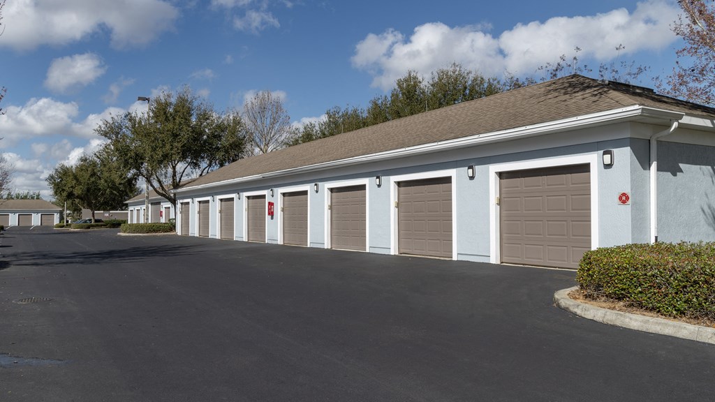 a row of garages in front of a blue sky