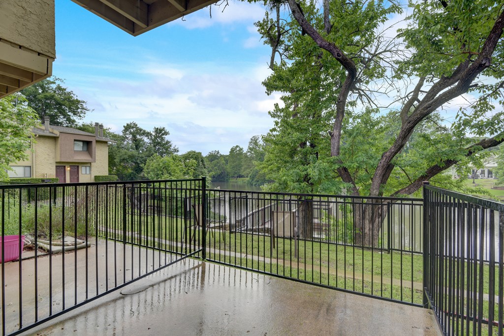 the preserve at ballantyne commons balcony guard rail with trees and a river