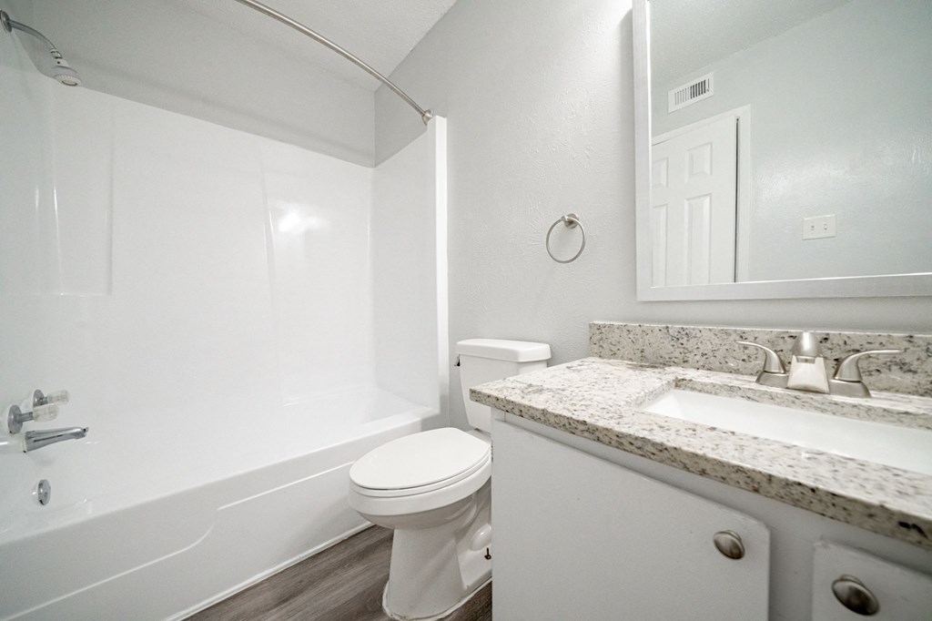 an empty bathroom with a toilet and a sink