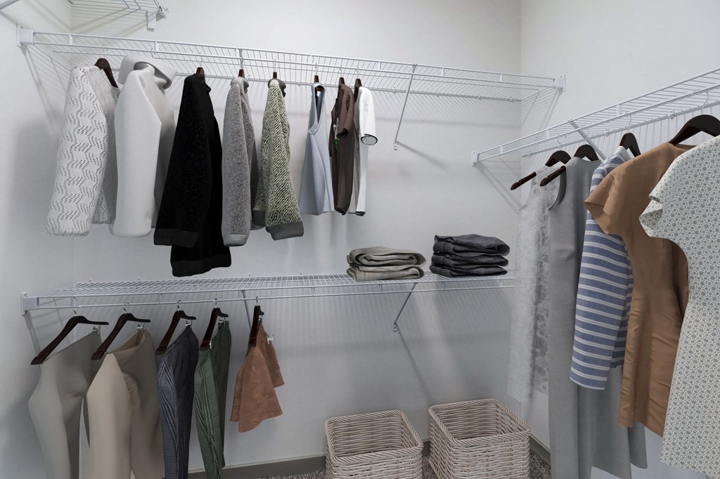 a closet with a rack of clothes hanging on the wall