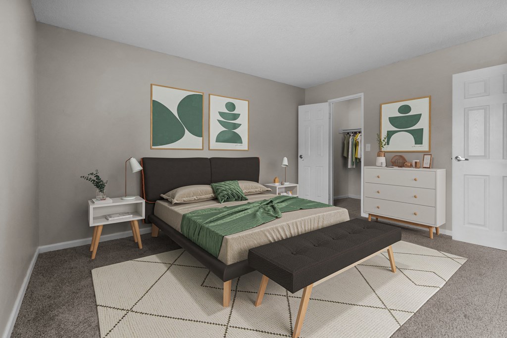 a bedroom with a bed and a dresser