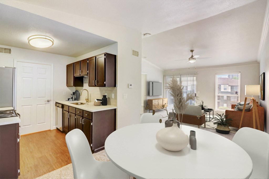a living room and dining room with a white table and chairs